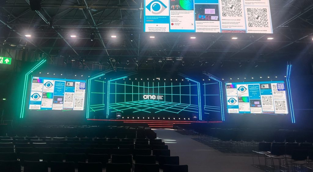 Main stage with screen displays and audience seating v2