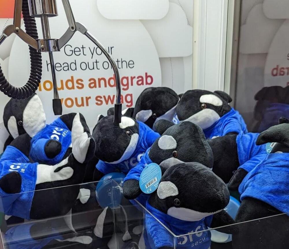 Orca mascot plushies as SWAG gift claw machine event activation