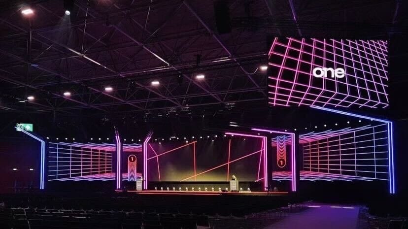 Stage with neon grid design and one branding